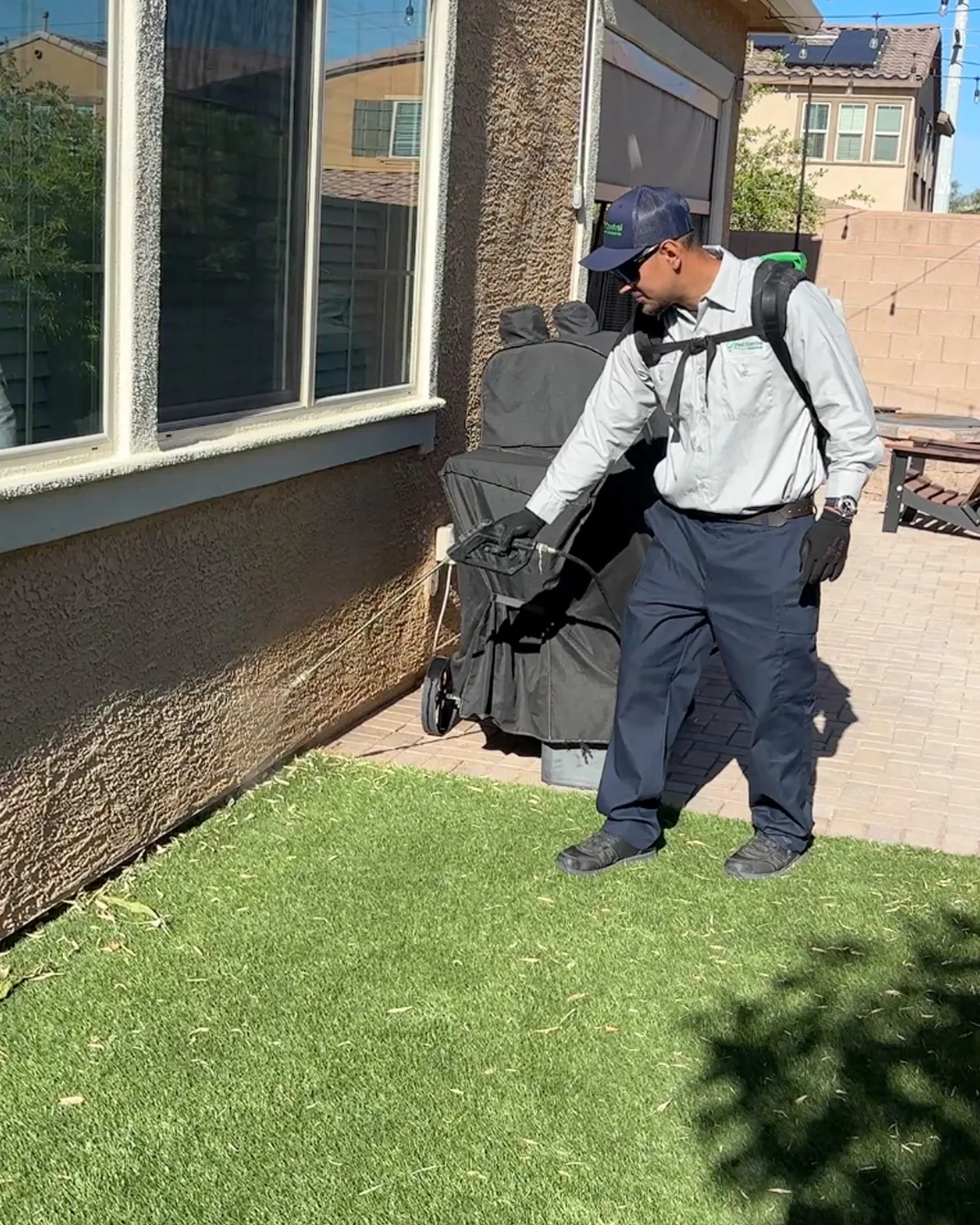 PCSI technician treating a Las Vegas home exterior